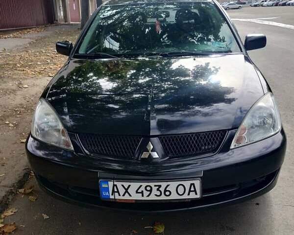 Чорний Міцубісі Lancer, об'ємом двигуна 1.58 л та пробігом 323 тис. км за 4500 $, фото 11 на Automoto.ua