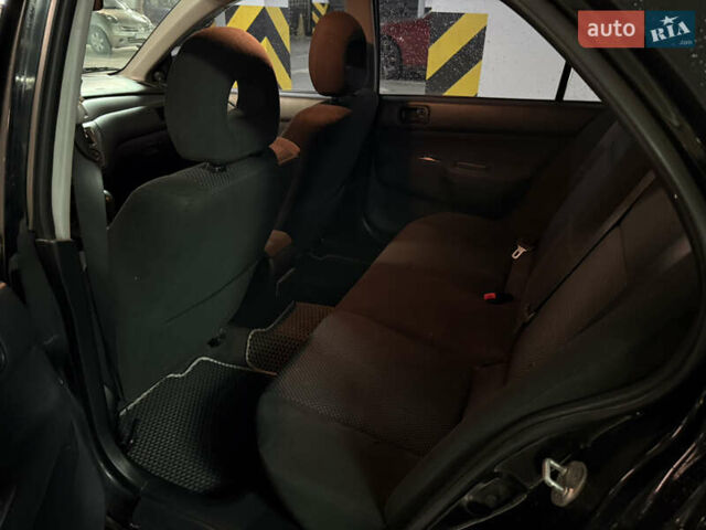 Чорний Міцубісі Lancer, об'ємом двигуна 1.58 л та пробігом 212 тис. км за 5500 $, фото 10 на Automoto.ua