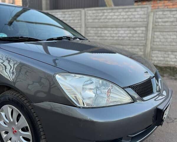 Черный Мицубиси Лансер, объемом двигателя 1.6 л и пробегом 225 тыс. км за 3400 $, фото 5 на Automoto.ua