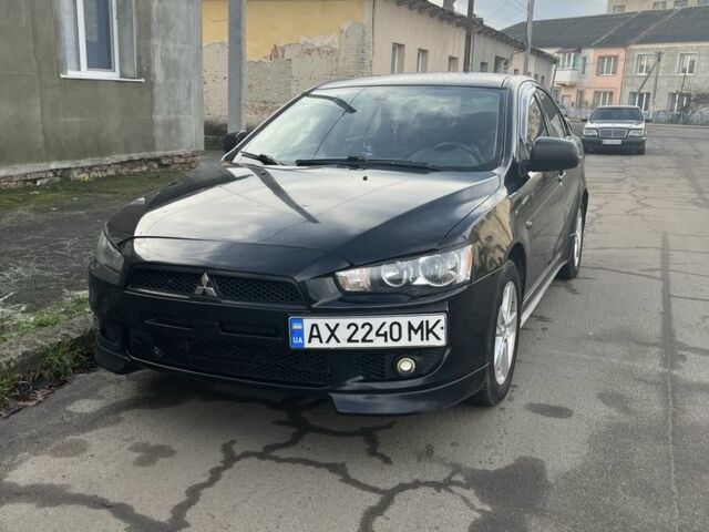 Черный Мицубиси Лансер, объемом двигателя 2 л и пробегом 270 тыс. км за 5600 $, фото 6 на Automoto.ua