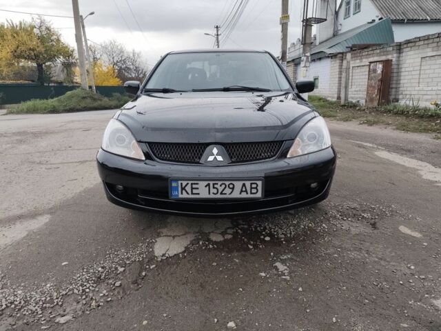 Черный Мицубиси Лансер, объемом двигателя 1.6 л и пробегом 270 тыс. км за 3800 $, фото 1 на Automoto.ua