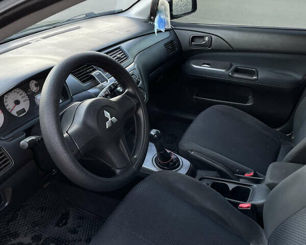 Черный Мицубиси Лансер, объемом двигателя 1.59 л и пробегом 348 тыс. км за 4200 $, фото 6 на Automoto.ua
