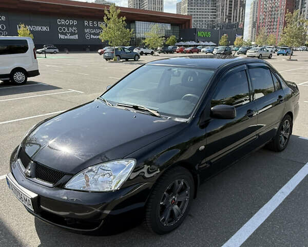 Черный Мицубиси Лансер, объемом двигателя 1.6 л и пробегом 321 тыс. км за 5000 $, фото 4 на Automoto.ua