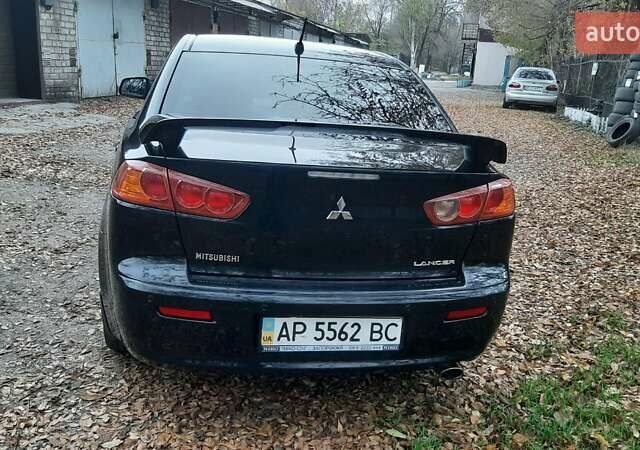Черный Мицубиси Лансер, объемом двигателя 2 л и пробегом 63 тыс. км за 8000 $, фото 2 на Automoto.ua