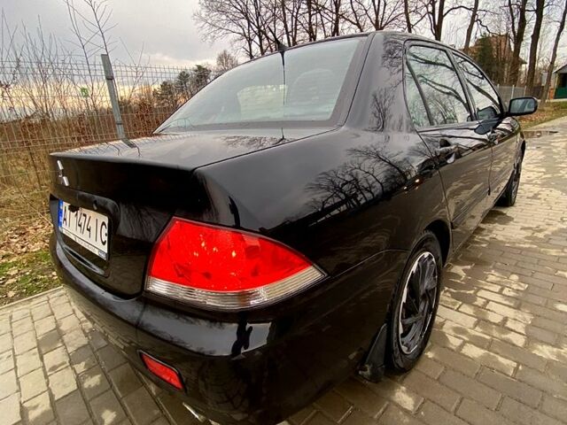 Черный Мицубиси Лансер, объемом двигателя 1.6 л и пробегом 240 тыс. км за 4200 $, фото 1 на Automoto.ua