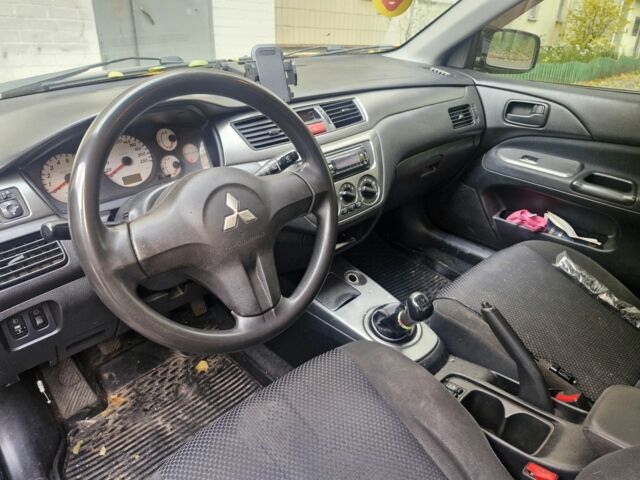 Черный Мицубиси Лансер, объемом двигателя 1.6 л и пробегом 243 тыс. км за 2900 $, фото 2 на Automoto.ua