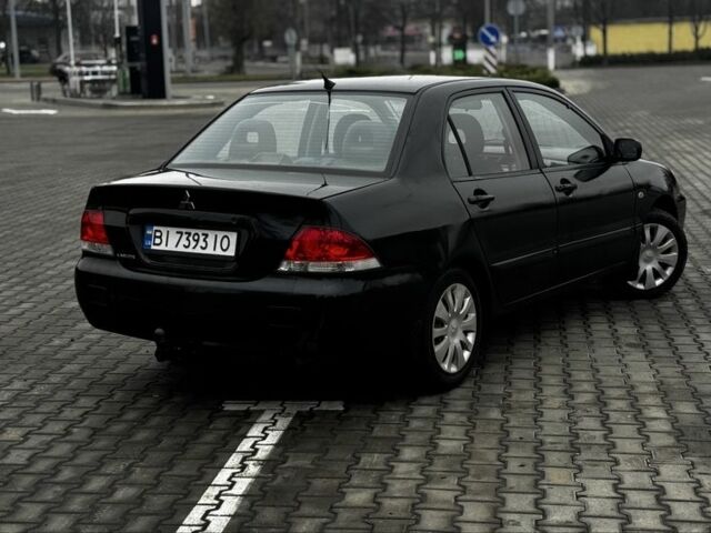 Черный Мицубиси Лансер, объемом двигателя 1.6 л и пробегом 168 тыс. км за 3700 $, фото 5 на Automoto.ua