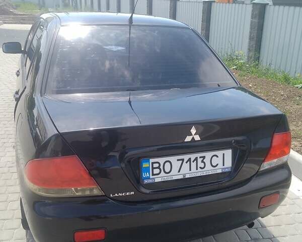 Чорний Міцубісі Lancer, об'ємом двигуна 1.58 л та пробігом 333 тис. км за 4100 $, фото 1 на Automoto.ua