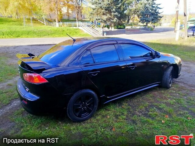 Черный Мицубиси Лансер, объемом двигателя 2 л и пробегом 196 тыс. км за 5500 $, фото 2 на Automoto.ua