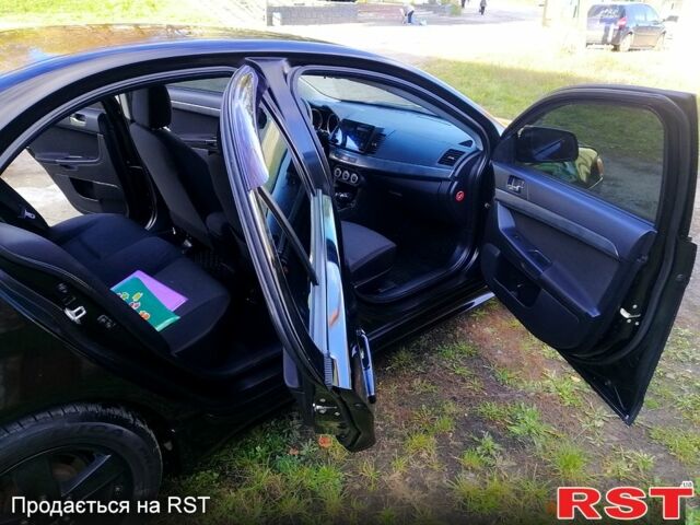 Черный Мицубиси Лансер, объемом двигателя 2 л и пробегом 196 тыс. км за 5500 $, фото 6 на Automoto.ua