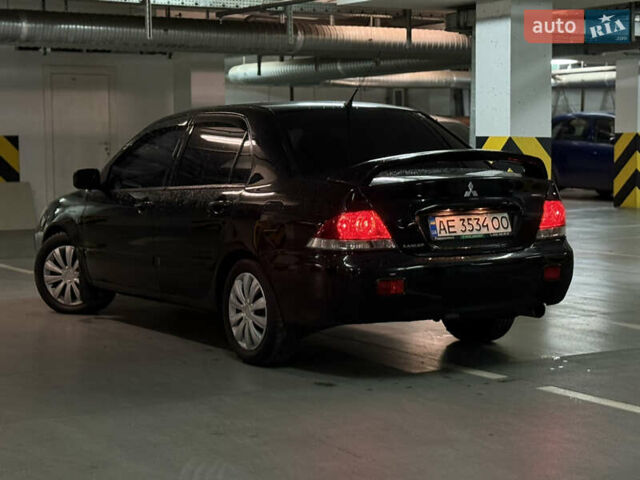 Чорний Міцубісі Lancer, об'ємом двигуна 1.58 л та пробігом 212 тис. км за 5500 $, фото 4 на Automoto.ua