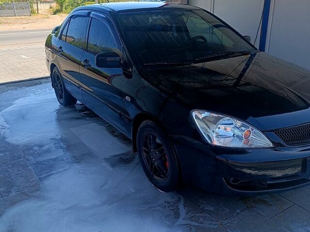 Чорний Міцубісі Lancer, об'ємом двигуна 1.6 л та пробігом 0 тис. км за 4200 $, фото 4 на Automoto.ua