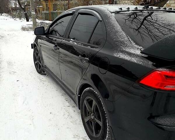 Чорний Міцубісі Lancer, об'ємом двигуна 2 л та пробігом 208 тис. км за 9500 $, фото 5 на Automoto.ua