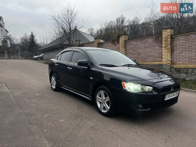Черный Мицубиси Лансер, объемом двигателя 2 л и пробегом 192 тыс. км за 6300 $, фото 1 на Automoto.ua