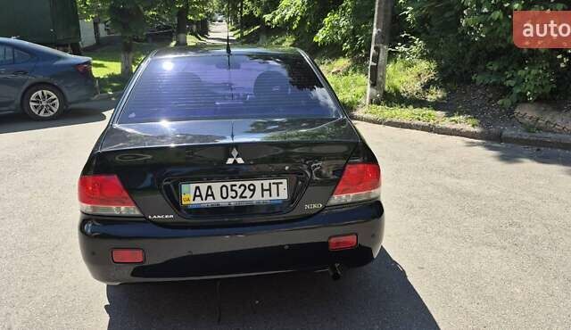 Чорний Міцубісі Lancer, об'ємом двигуна 1.6 л та пробігом 210 тис. км за 4800 $, фото 2 на Automoto.ua