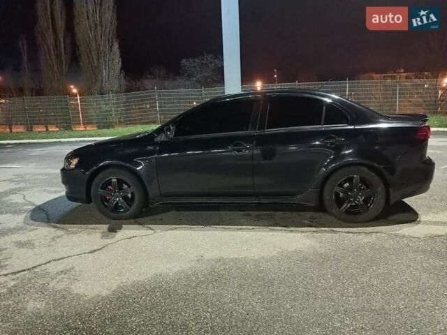 Черный Мицубиси Лансер, объемом двигателя 2 л и пробегом 240 тыс. км за 6400 $, фото 7 на Automoto.ua