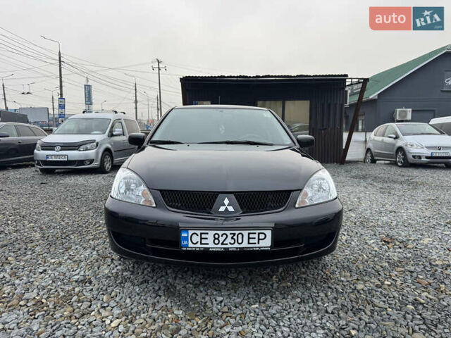 Черный Мицубиси Лансер, объемом двигателя 1.58 л и пробегом 202 тыс. км за 4100 $, фото 23 на Automoto.ua