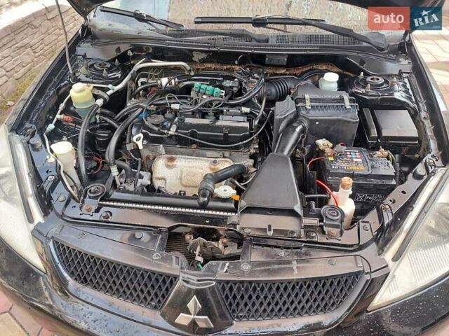 Чорний Міцубісі Lancer, об'ємом двигуна 1.6 л та пробігом 215 тис. км за 4900 $, фото 8 на Automoto.ua