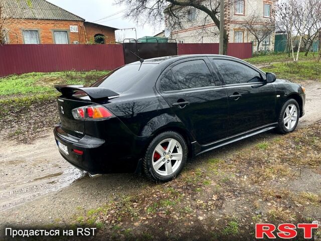 Черный Мицубиси Лансер, объемом двигателя 2 л и пробегом 226 тыс. км за 6600 $, фото 7 на Automoto.ua