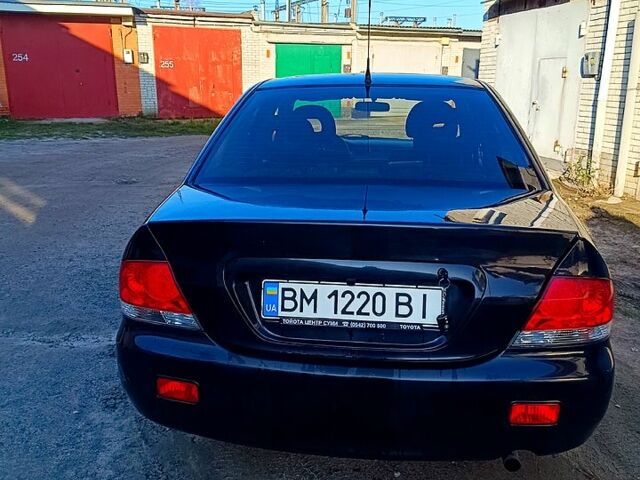 Черный Мицубиси Лансер, объемом двигателя 1.6 л и пробегом 230 тыс. км за 4700 $, фото 1 на Automoto.ua