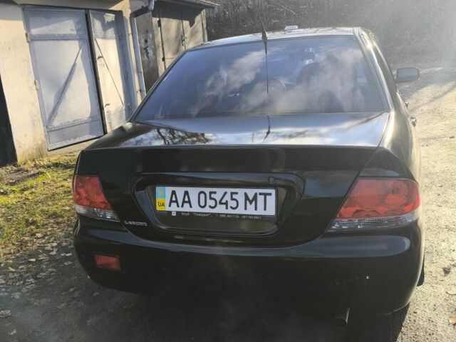 Черный Мицубиси Лансер, объемом двигателя 1.6 л и пробегом 243 тыс. км за 3200 $, фото 4 на Automoto.ua