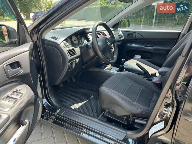 Чорний Міцубісі Lancer, об'ємом двигуна 1.6 л та пробігом 296 тис. км за 4200 $, фото 31 на Automoto.ua