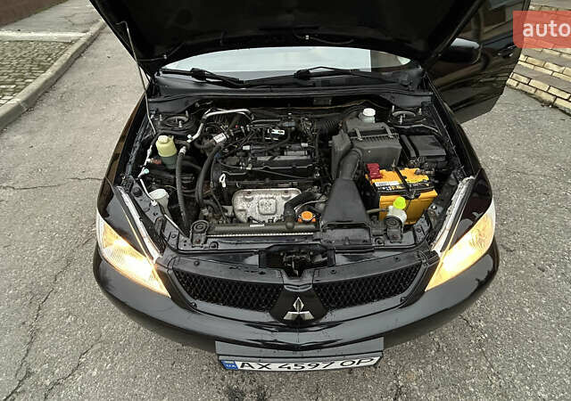 Чорний Міцубісі Lancer, об'ємом двигуна 1.58 л та пробігом 167 тис. км за 4800 $, фото 15 на Automoto.ua