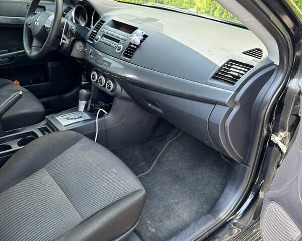 Чорний Міцубісі Lancer, об'ємом двигуна 2 л та пробігом 217 тис. км за 7800 $, фото 22 на Automoto.ua
