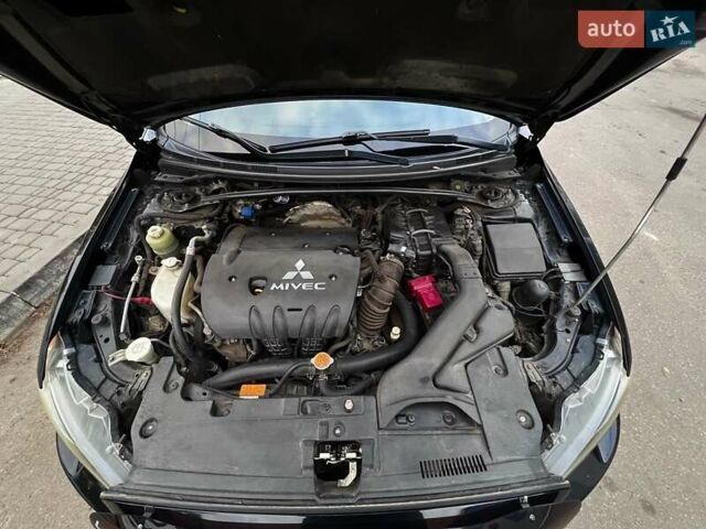 Черный Мицубиси Лансер, объемом двигателя 2 л и пробегом 222 тыс. км за 6000 $, фото 3 на Automoto.ua