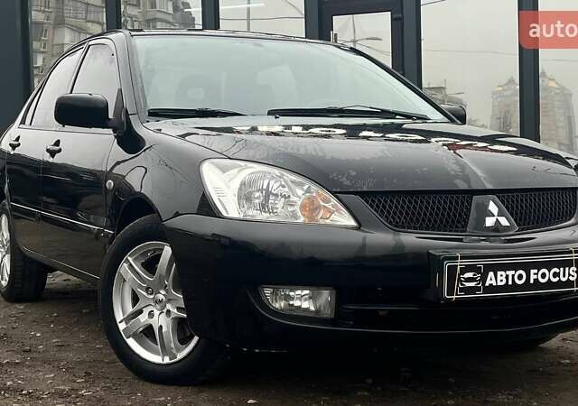 Чорний Міцубісі Lancer, об'ємом двигуна 1.6 л та пробігом 340 тис. км за 6190 $, фото 1 на Automoto.ua