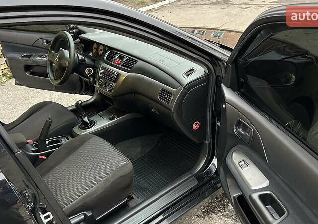 Чорний Міцубісі Lancer, об'ємом двигуна 1.58 л та пробігом 167 тис. км за 4800 $, фото 10 на Automoto.ua