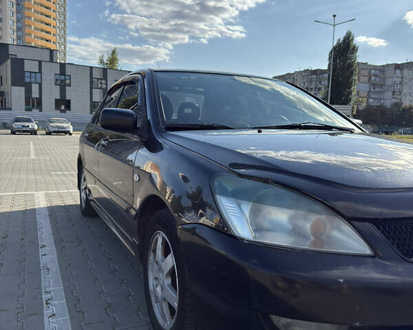 Черный Мицубиси Лансер, объемом двигателя 1.58 л и пробегом 364 тыс. км за 3000 $, фото 1 на Automoto.ua