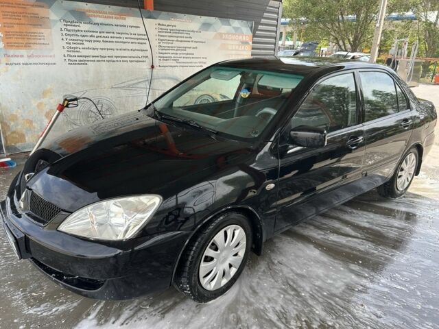 Чорний Міцубісі Lancer, об'ємом двигуна 1.6 л та пробігом 250 тис. км за 3900 $, фото 1 на Automoto.ua