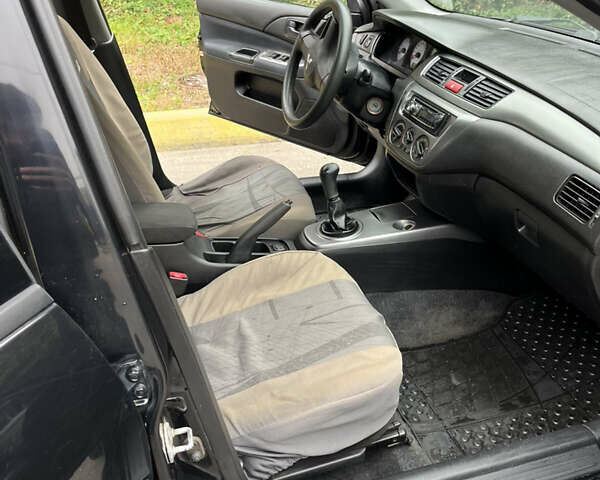 Чорний Міцубісі Lancer, об'ємом двигуна 1.58 л та пробігом 192 тис. км за 4500 $, фото 8 на Automoto.ua