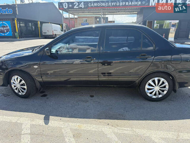 Чорний Міцубісі Lancer, об'ємом двигуна 1.6 л та пробігом 292 тис. км за 3600 $, фото 3 на Automoto.ua