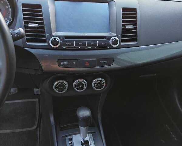 Черный Мицубиси Лансер, объемом двигателя 2 л и пробегом 245 тыс. км за 5600 $, фото 9 на Automoto.ua