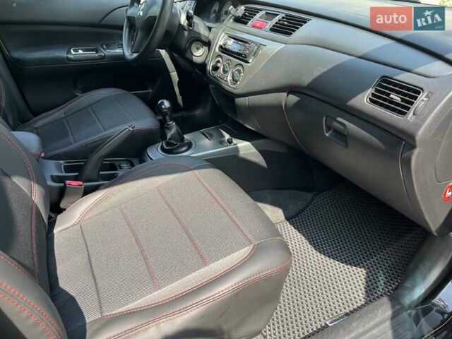 Чорний Міцубісі Lancer, об'ємом двигуна 1.6 л та пробігом 296 тис. км за 4200 $, фото 44 на Automoto.ua