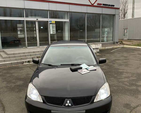 Черный Мицубиси Лансер, объемом двигателя 1.6 л и пробегом 350 тыс. км за 4500 $, фото 4 на Automoto.ua