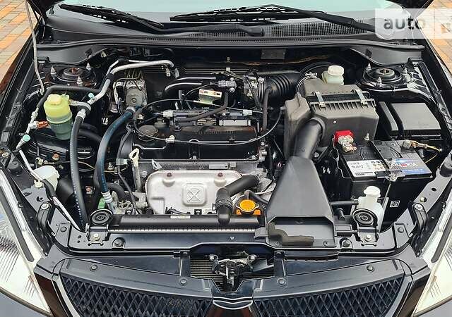 Чорний Міцубісі Lancer, об'ємом двигуна 1.6 л та пробігом 26 тис. км за 9000 $, фото 49 на Automoto.ua