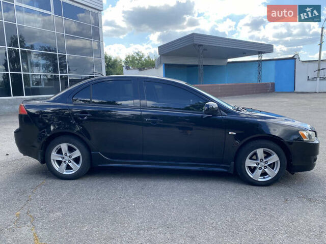 Черный Мицубиси Лансер, объемом двигателя 2 л и пробегом 200 тыс. км за 5500 $, фото 2 на Automoto.ua