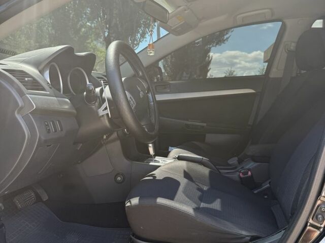 Чорний Міцубісі Lancer, об'ємом двигуна 2 л та пробігом 163 тис. км за 8000 $, фото 4 на Automoto.ua