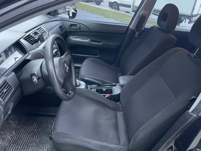 Черный Мицубиси Лансер, объемом двигателя 1.6 л и пробегом 226 тыс. км за 3750 $, фото 9 на Automoto.ua