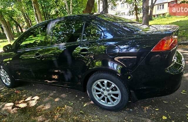Черный Мицубиси Лансер, объемом двигателя 1.5 л и пробегом 205 тыс. км за 6300 $, фото 6 на Automoto.ua