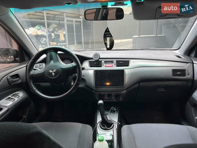 Черный Мицубиси Лансер, объемом двигателя 1.6 л и пробегом 167 тыс. км за 4850 $, фото 2 на Automoto.ua