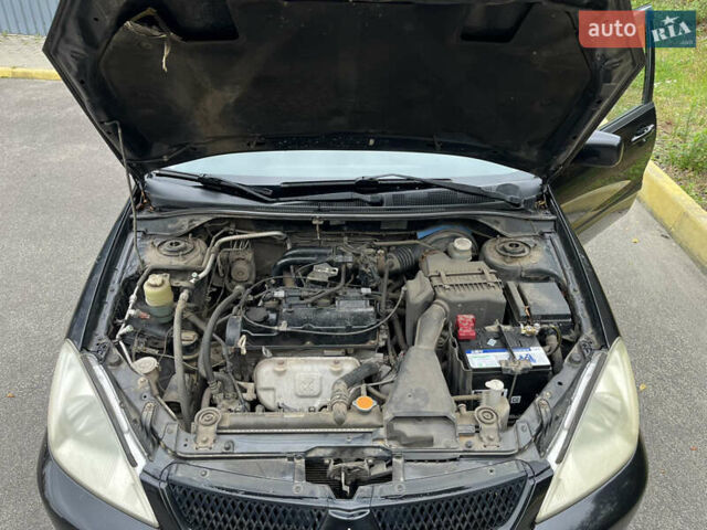 Чорний Міцубісі Lancer, об'ємом двигуна 1.58 л та пробігом 192 тис. км за 4500 $, фото 20 на Automoto.ua