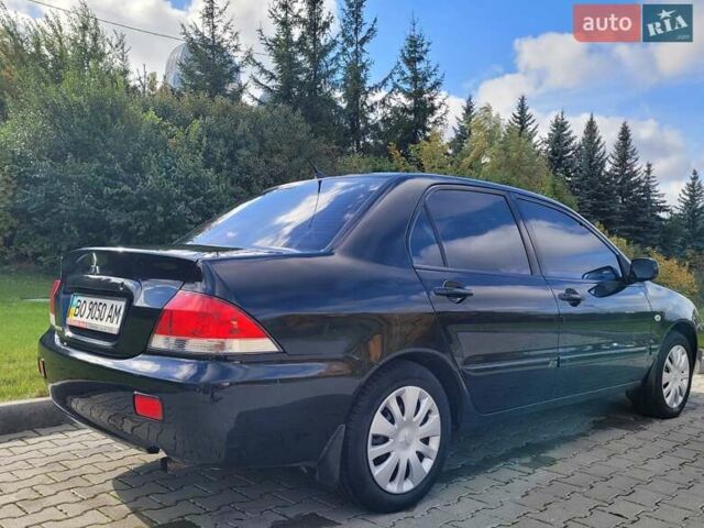 Міцубісі Lancer 2008 у Тернополі на Automoto.ua Чорний Міцубісі Lancer, об'ємом двигуна 1.58 л та пробігом 182 тис. км за 5600 $, фото 10 на Automoto.ua