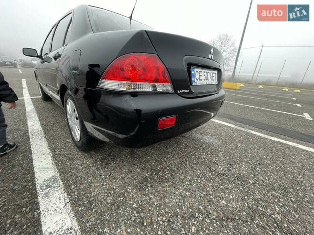 Черный Мицубиси Лансер, объемом двигателя 1.58 л и пробегом 214 тыс. км за 4400 $, фото 7 на Automoto.ua