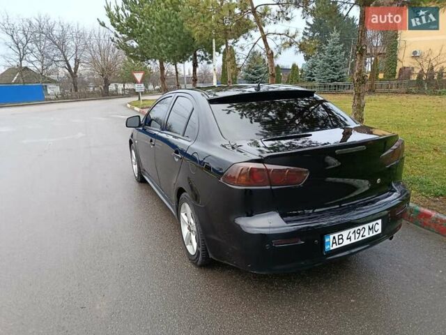 Черный Мицубиси Лансер, объемом двигателя 2 л и пробегом 200 тыс. км за 5100 $, фото 12 на Automoto.ua