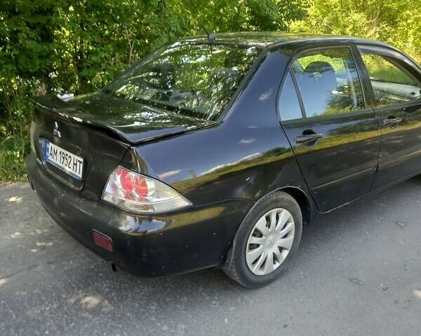 Черный Мицубиси Лансер, объемом двигателя 1.6 л и пробегом 320 тыс. км за 3800 $, фото 4 на Automoto.ua