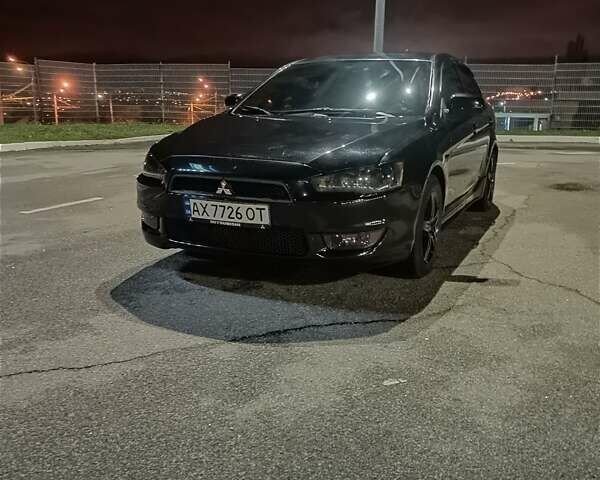 Черный Мицубиси Лансер, объемом двигателя 2 л и пробегом 240 тыс. км за 6400 $, фото 2 на Automoto.ua